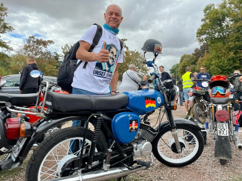 Martin Krause with his moped. Nette Nöstlinger