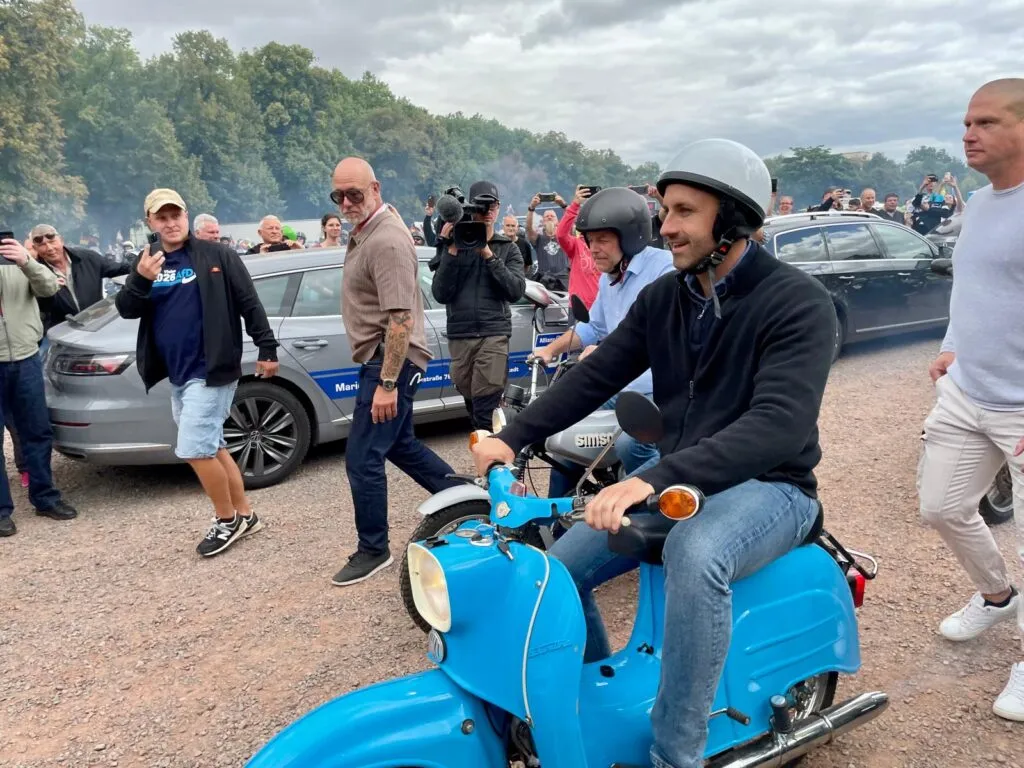 AfD leader Siegmund on his blue Schwalbe as he drives out in front of the convoy. Nette Nöstlinger