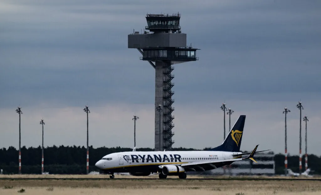 Ryanair aircraft taxiing past BER control tower