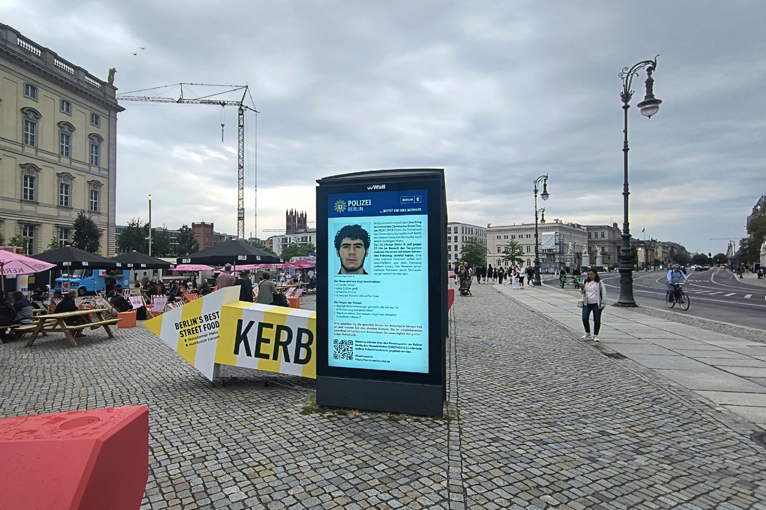 Digital display showing a photo of Abdul Ballout on July 26, 2026